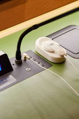 Earpiece worn by delegates to listen to interpretation feeds