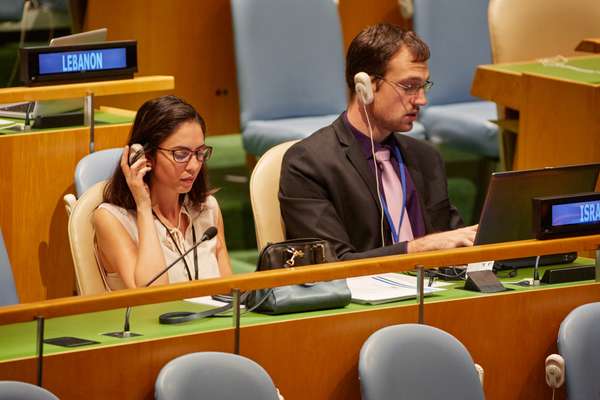 Delegates from Israel listen to a debate