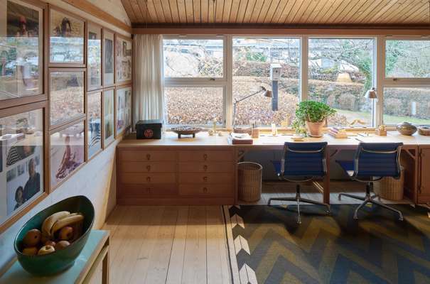 Family room and office, the epicentre of the house. The desks are by Mogensen and the wooden fixed frames by his teacher Kaare Klint