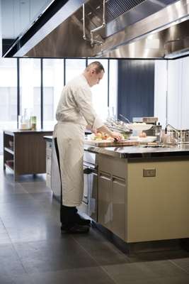 Chefs prepare snacks in Apartment 2E