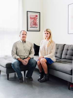 Andrew Moss with 
his daughter at home in Lawrenceville
