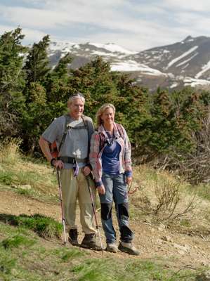 Pat Thompson and Holly Macleod hiking on Flattop Mountain