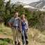 Pat Thompson and Holly Macleod hiking on Flattop Mountain