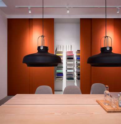 Kvadrat meeting room featuring a table by Dinesen, chairs by Jaime Hayon and lights by Space Copenhagen 