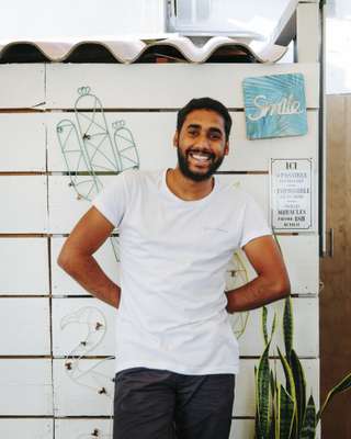 Waiter at Paillotte Tahiti beach café, Ajaccio