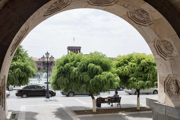 A man seeks shade at Republic Square