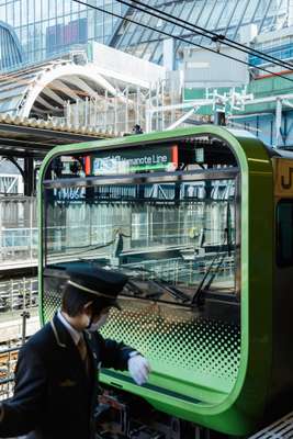 Train guard on the Yamanote line at Shibuya station 