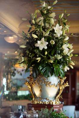 Fresh lilies adorn the dining room