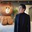 Line CEO Takeshi Idezawa, flanked by a giant version of Brown