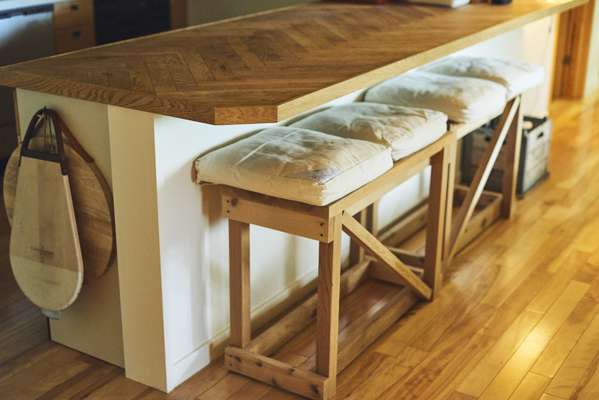 Wooden counter with benches by Takanori Ota of OFC