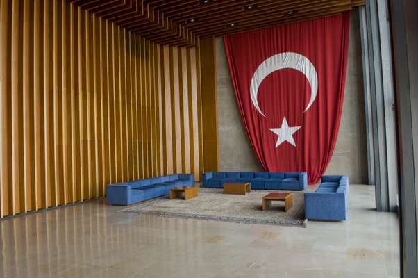 A flag of the Republic of Turkey adorns one end of the foyer