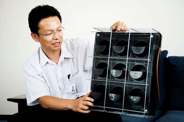 Toshiyuki Hosoya shows one of the planting units 