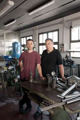 Master and apprentice in their workshop