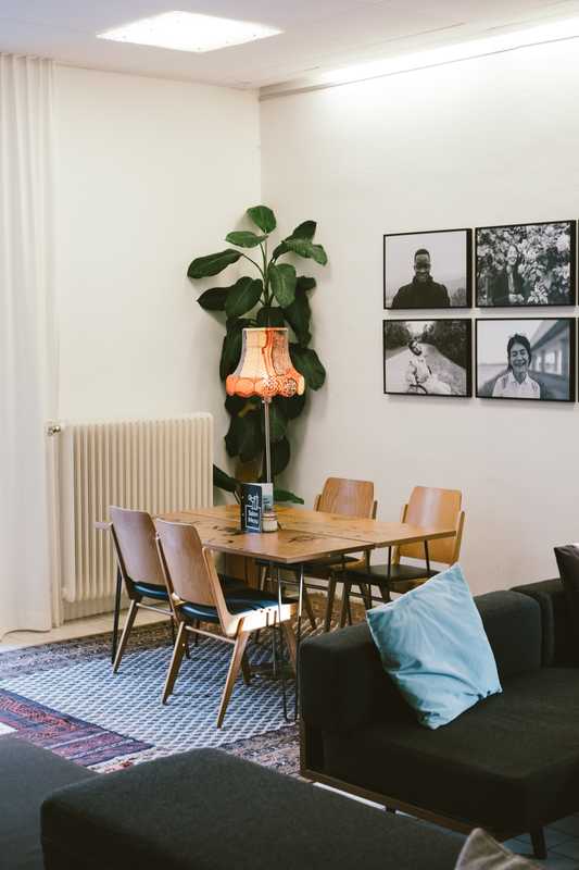 The lobby area of Vienna’s eclectic Magdas Hotel, with walls adorned with photography sourced from a nearby school