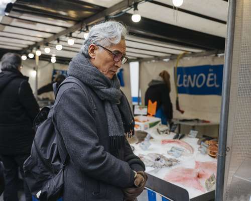 Examining the catch of the day at Pierre Lenoël’s fish stand 