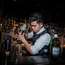Unusual barman attire: a bulletproof vest 