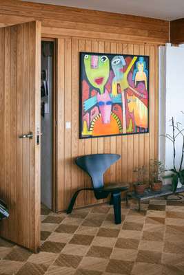 Wooden walls and seaweed floors form  the backdrop for the PK0 chair 