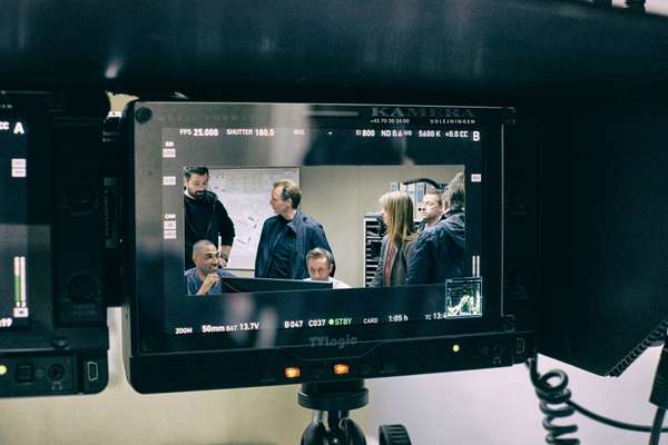 Actors and camera operators prepare for the next scene 