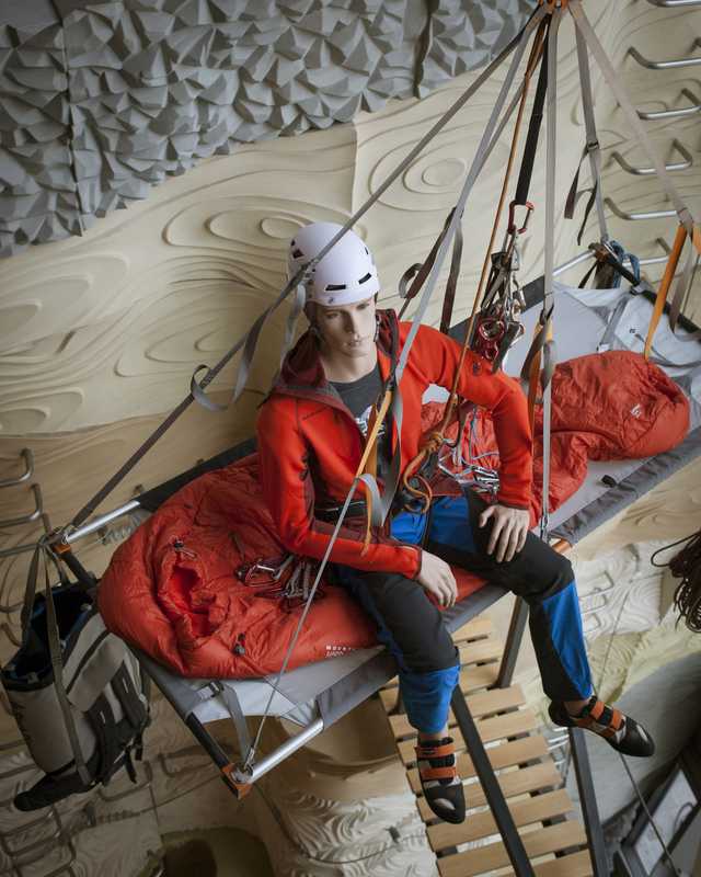 Mannequin greets climbers at  the top of the climbing wall