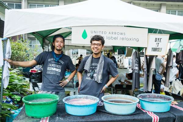 Dyeing artisan Yukihito Kanai (right) from Amami-Oshima island