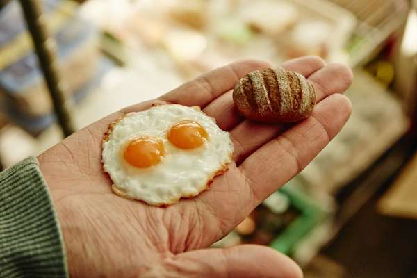 Miniature props, including eggs sunny-side up 