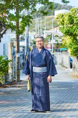 Satoru Oshiro in a traditional Ryukyu kasuri kimono 
