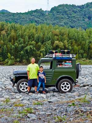 Toshihiko Muramatsu and son Yuha with their DIY sleeper Jimny