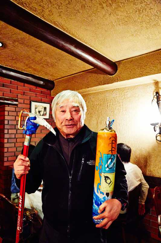 Miura with his oxygen tank and ice axe