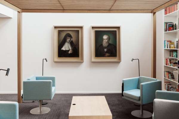 Portraits of the two founders of the school hanging in the library