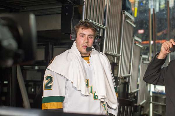 Evan Bouchard drying off during a post-match interview