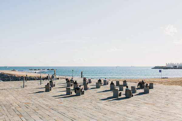 People sunbathing on Bogatell Beach