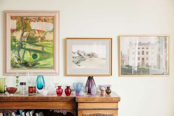 Paintings and glassware in the  middle-floor sitting room 