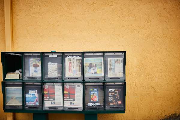 Newstand outside a strip mall