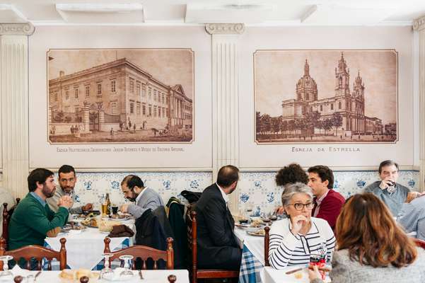 Diners tuck in at Casa dos Pasarinhos, open since 1923