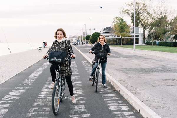 French tourists enjoyng the cycle lane near the Maat museum