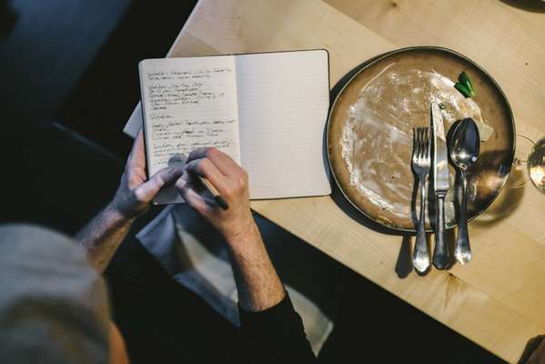 Food critic Florian Holzer making notes