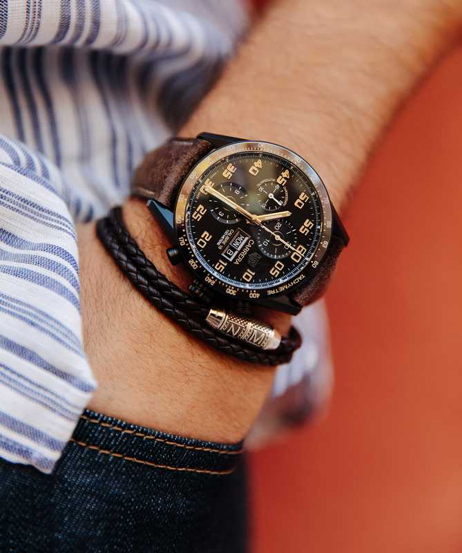 Shirt by Oliver Spencer, jeans by Prada, watch by Tag Heuer, bracelet by Tateossian