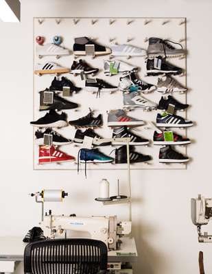 Wall of prototype sneakers in The MakerLab, a design studio in the Portland HQ