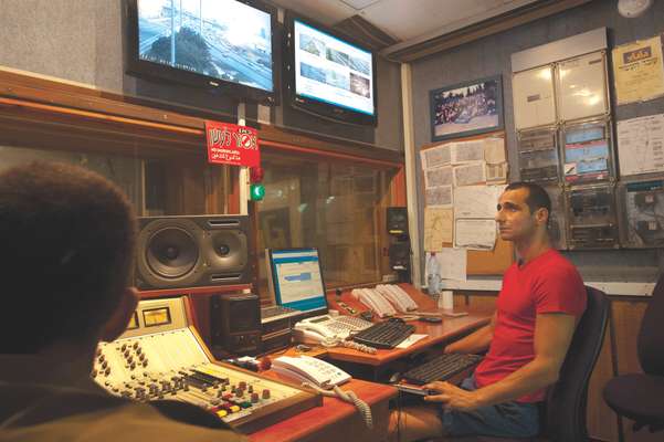 Benny Kevodi, chief transportation editor, in his studio