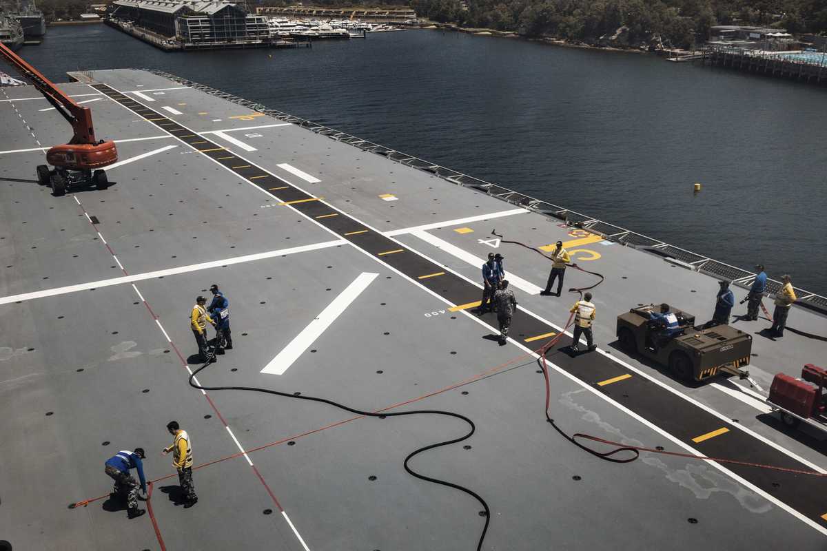 Crew members completing maintenance on the flight deck