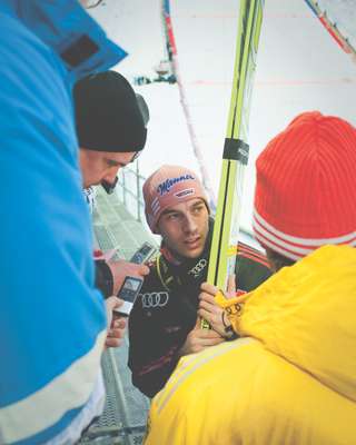 German ski jumper Michael Neumayer is interviewed by journalists 