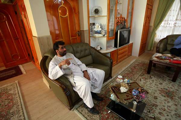 Nasiri in a finished room of one of the six new family houses