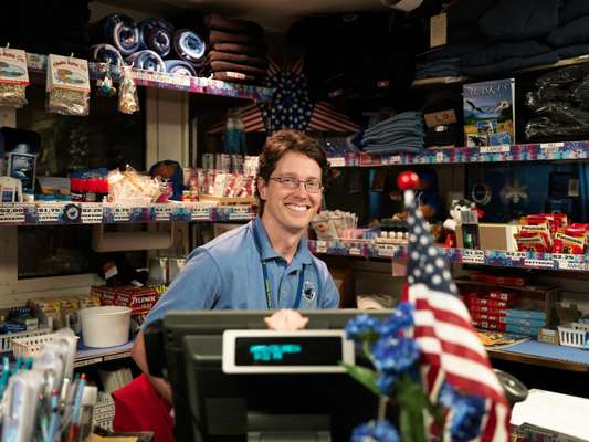 A deck steward in the ship’s gift shop
