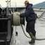 A deck winch tightens Columbia’s tie-up lines