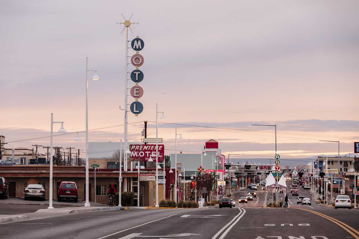 View towards Albuquerque along the  old Route 66, with some of its surviving neon motel signs