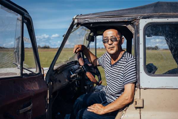 Hay harvester in his classic Soviet jeep UAZ near Byutyay Yurdya, 130km north of Yakutsk
