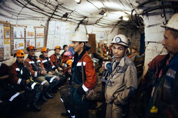 Miners waiting for a lift after their shift in International mine, 16km from Mirny