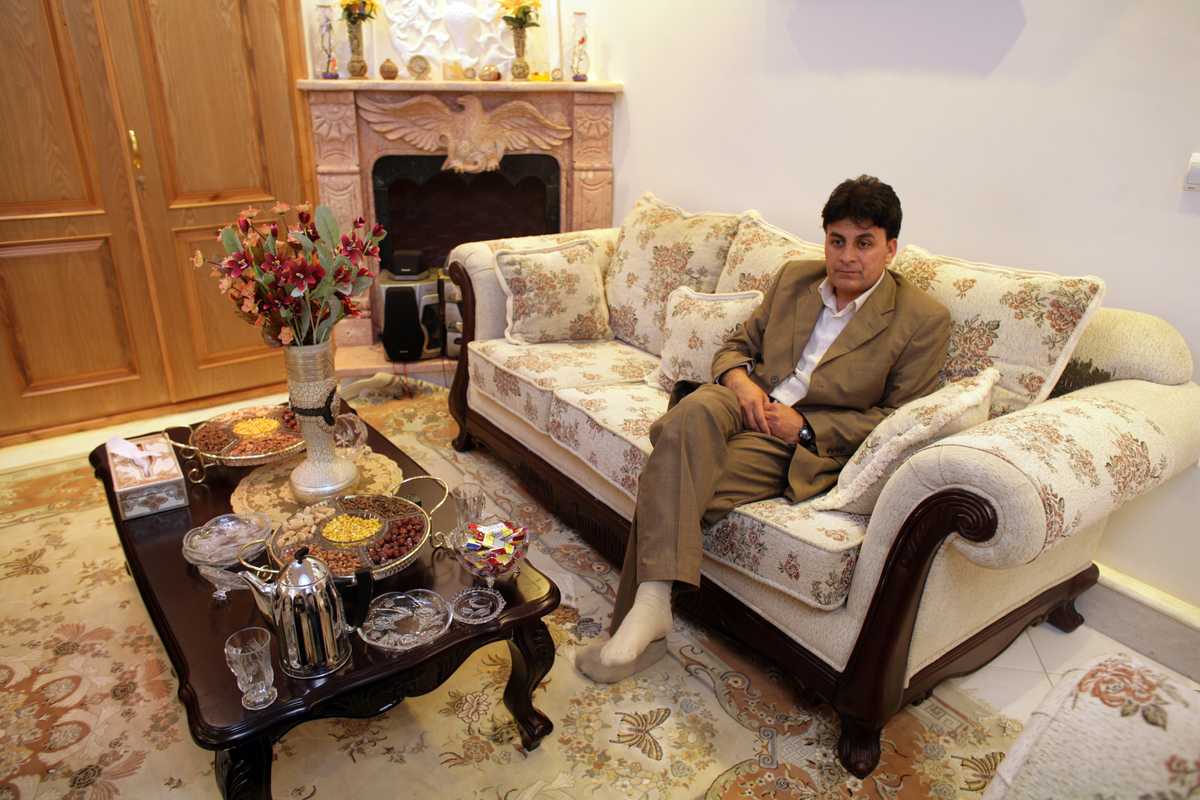 Faqiry, a legitimate local businessman, relaxes in his sitting room