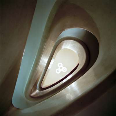 Skyward view of marble staircase at Teatro Filodrammatici 