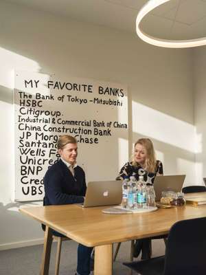 Senior partner Kyösti Siltala checks emails in front of Finnish artist Sami Lukkarinen’s ‘Young Bill Gates’